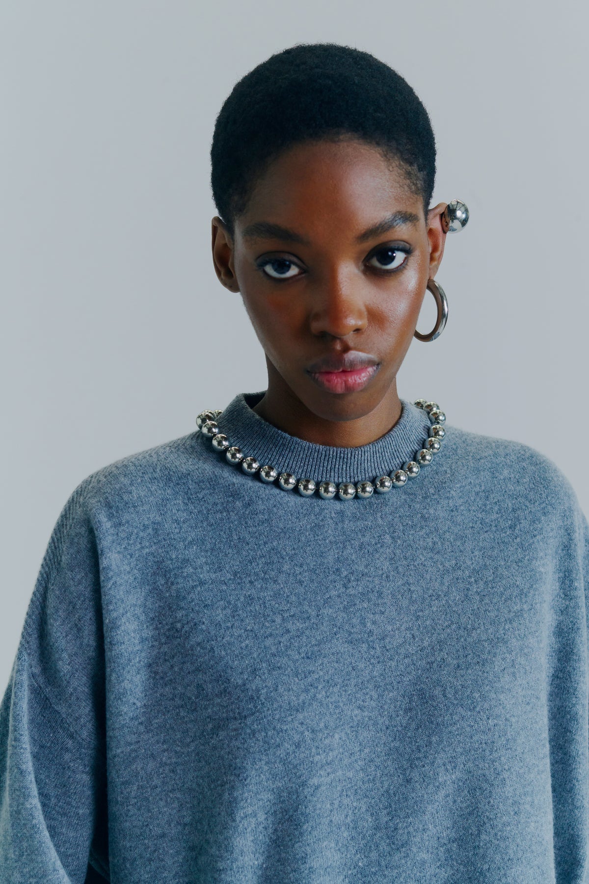 Knitwear With Embroidered Appliques